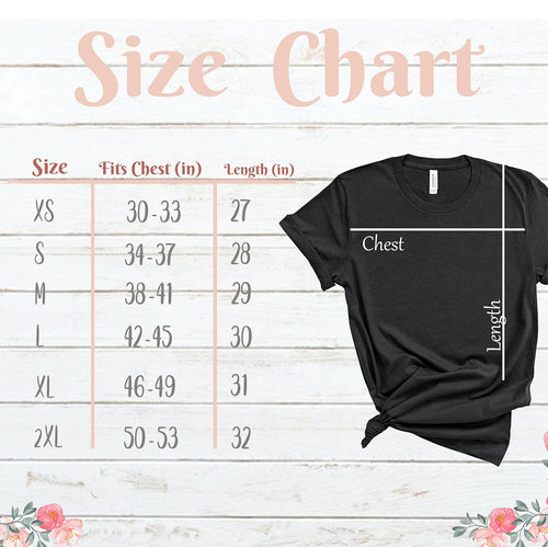 Black t-shirt with size chart on a wooden background