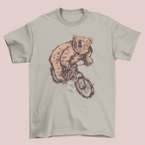 Gray t-shirt with a bear riding a bicycle graphic on a white background