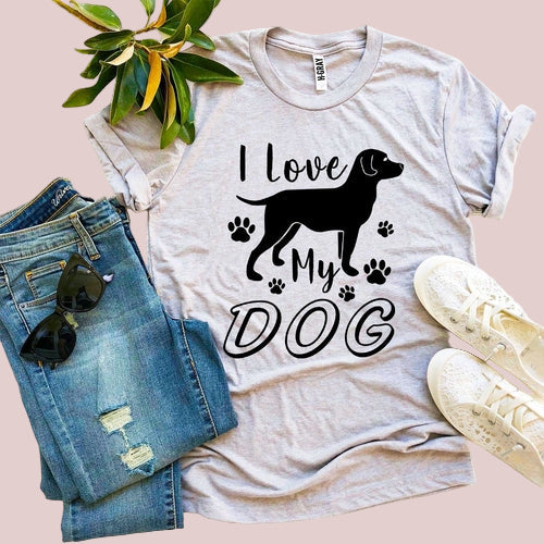 Gray t-shirt with 'I Love My Dog' graphic, paired with jeans and sneakers on a white background