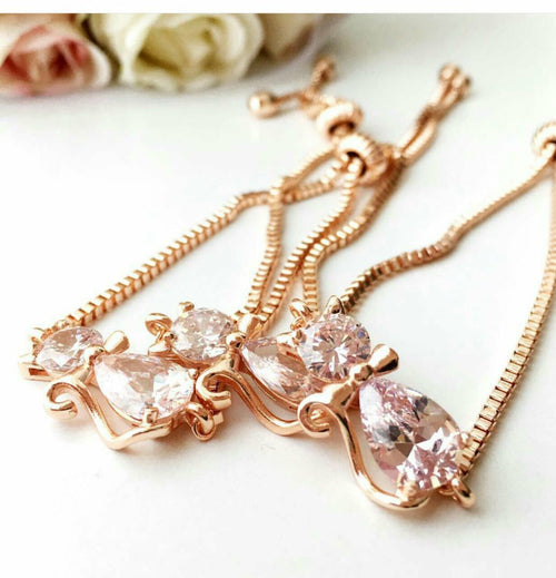 Handmade rose gold adjustable cat bracelet with Swarovski charm and evil eye bead.