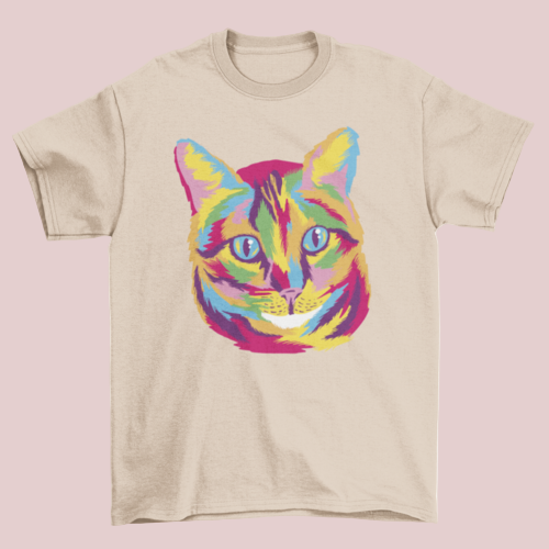 Beige t-shirt with a colorful cat graphic on a white background