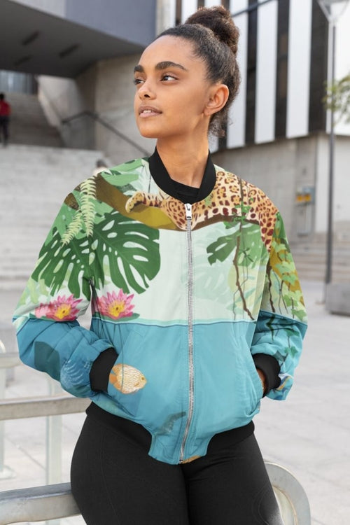 Person wearing a colorful jacket with nature-themed design outdoors.