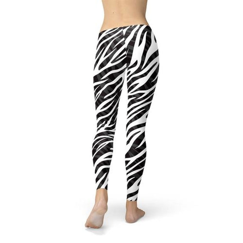 Zebra print leggings worn by a person on a white background