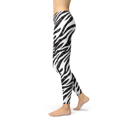 Zebra print leggings worn by a person on a white background